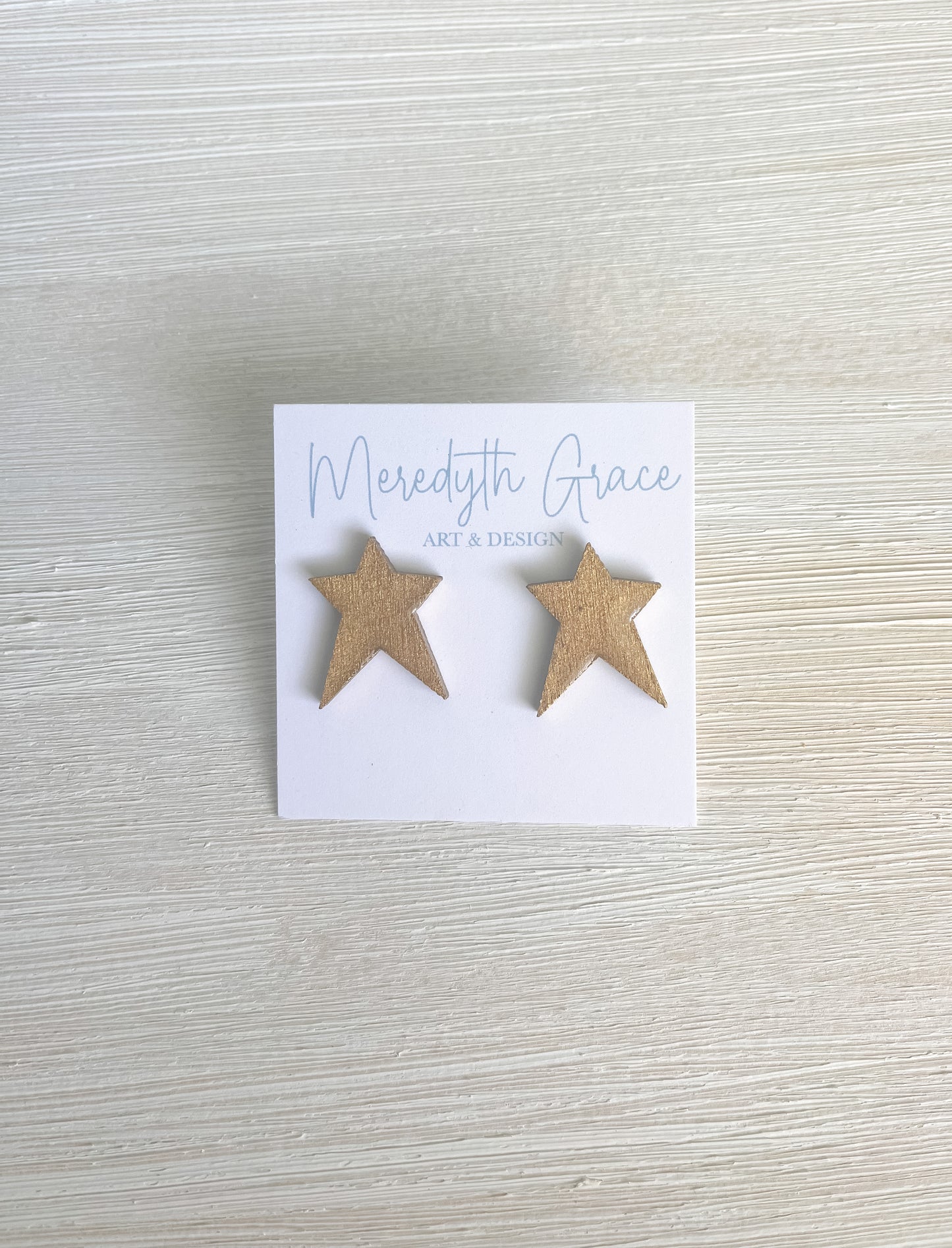Gold star earrings